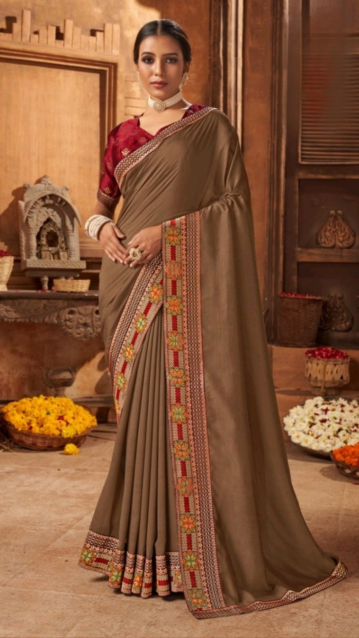 Elegant grey poly silk saree paired with a matching blouse