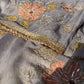 Close-up of grey silk dupatta with sheer organza fabric and subtle thread work