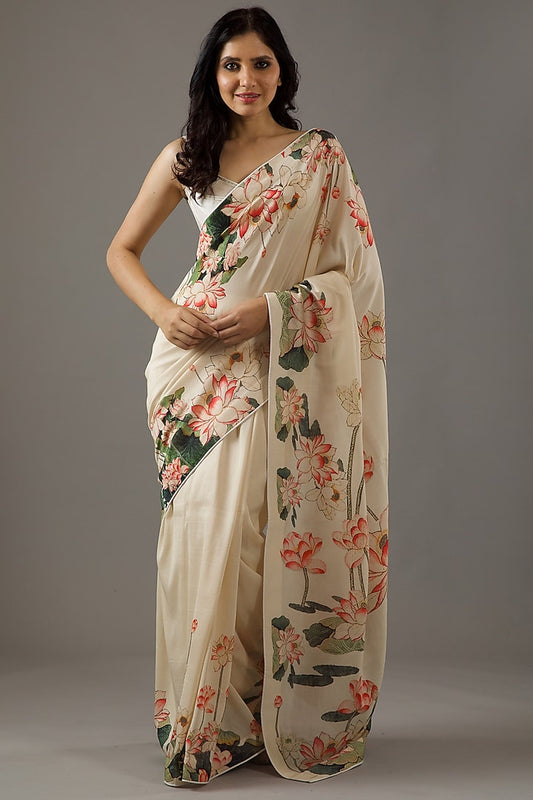 Graceful ivory silk Chanderi saree set with intricate prints, perfect for elegant occasions and traditional celebrations.