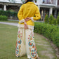 Modern yellow co-ord set with playful fringe accents