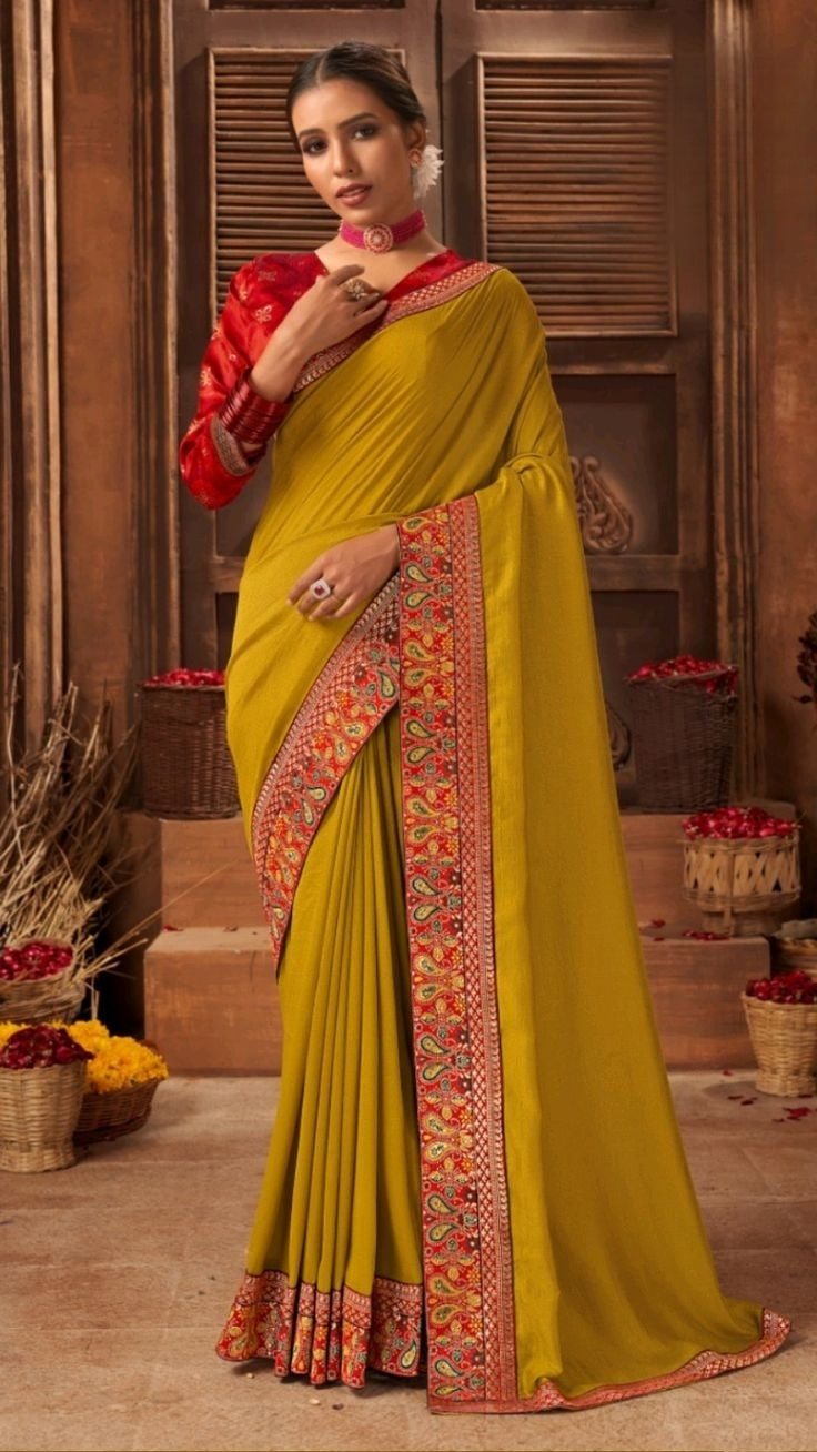 Elegant mustard poly silk saree with a matching blouse, perfect for festive and formal occasions.