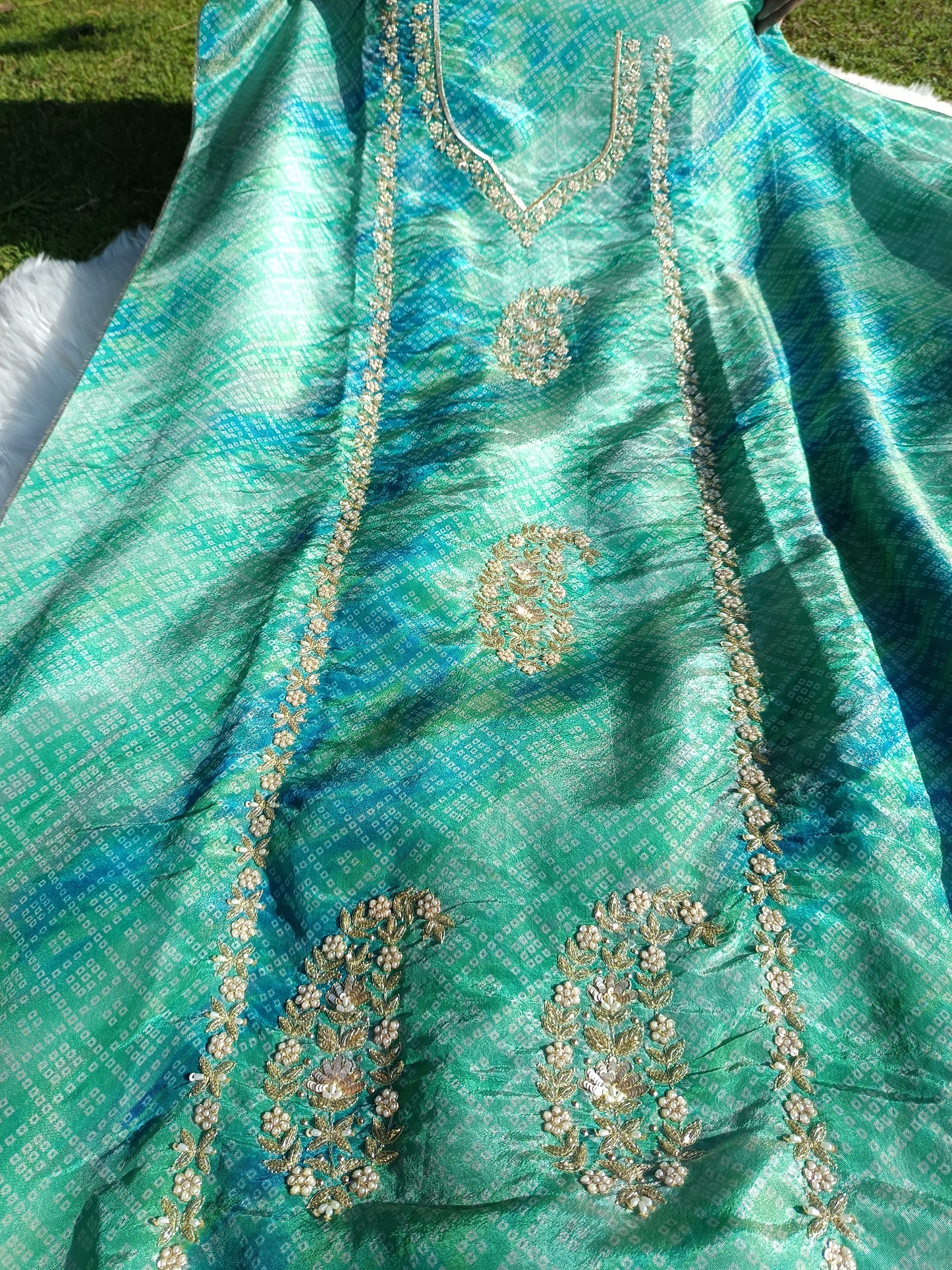 Fine texture and sheen of organza silk fabric in Bandhani print