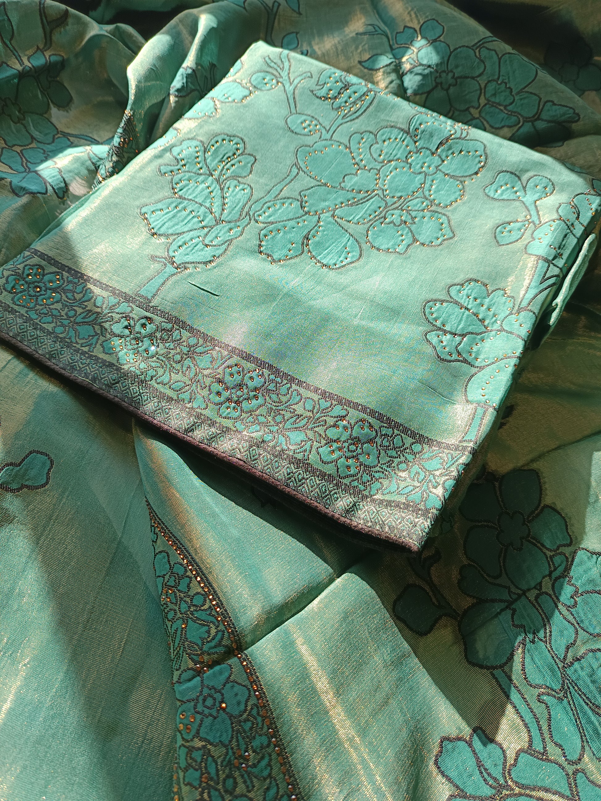 Close-up of the Parsi Serosky suit fabric highlighting delicate handwork and serosky embellishments
