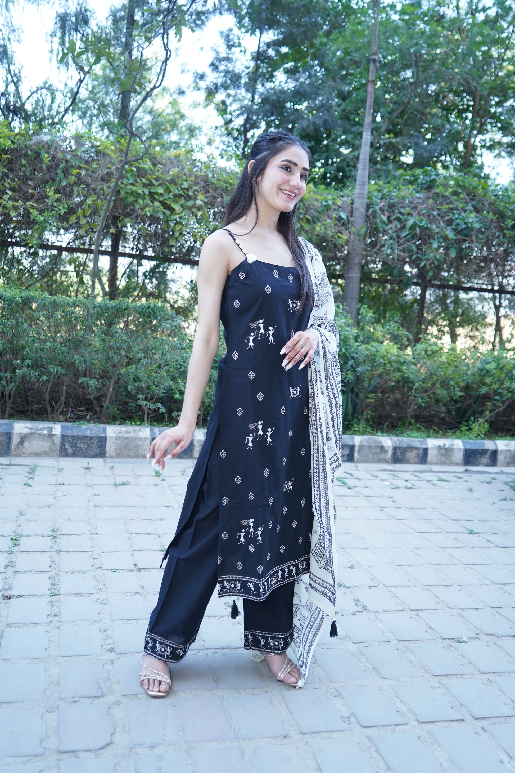 Premium Shehnaaz black straight suit with intricate embroidery.