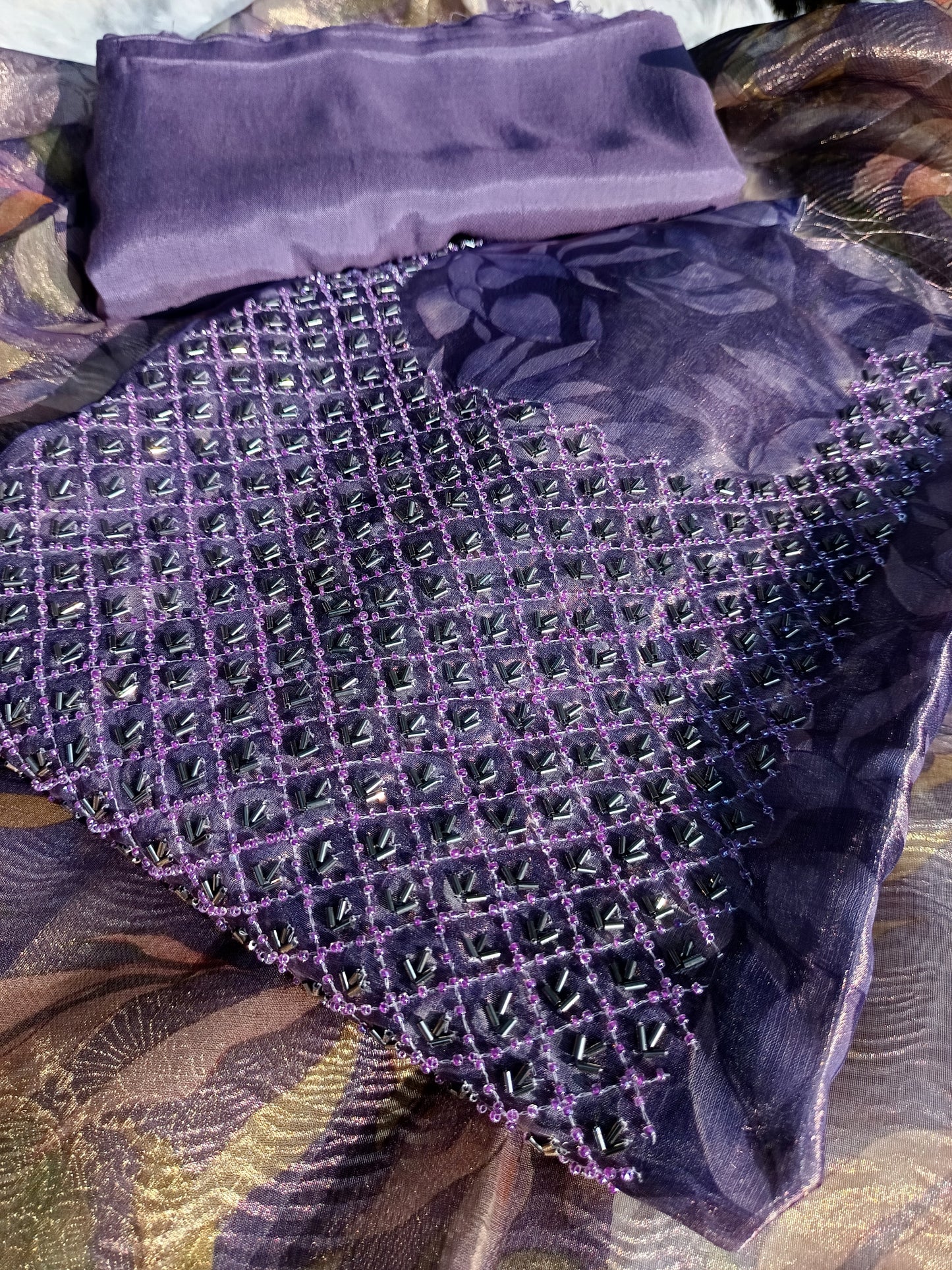 Luxurious tissue silk fabric used in hand-embroidered ethnic suit

