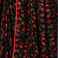 Stylish georgette saree in black and red, featuring bold prints and an unstitched blouse.
