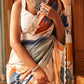 Stylish ivory chiffon saree with artistic prints, offering comfort and sophistication for festive or formal events.