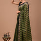 An elegant pure cotton mulmul saree adorned with exclusive prints, paired with a matching blouse for a sophisticated finish.