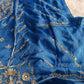Designer organza suit with intricate handwork shown in a curated outfit layout.