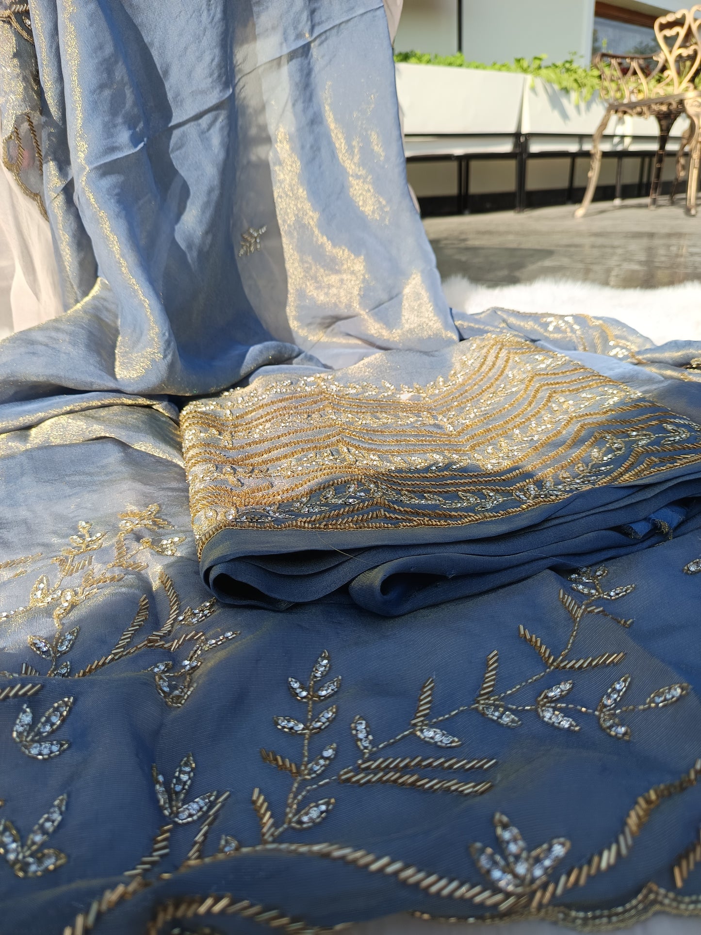 Close-up of delicate embroidery on the sleeve of the Pure Tissue Silk Suit