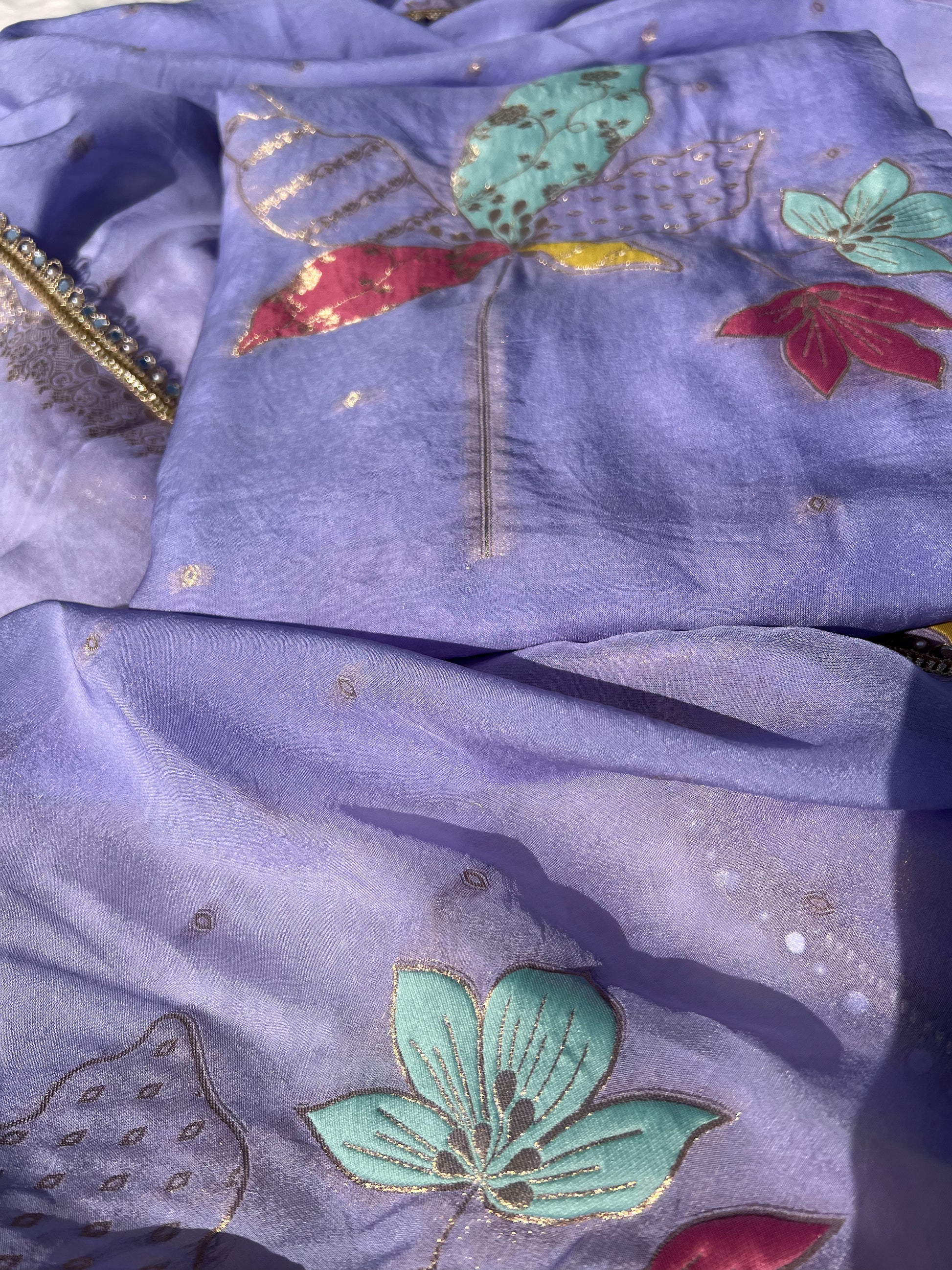 Back view of purple organza silk suit with delicate detailing