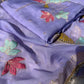 Close-up of embroidery work on the purple silk organza suit