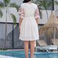 Serene floral embroidered dress with puff sleeve elegance.