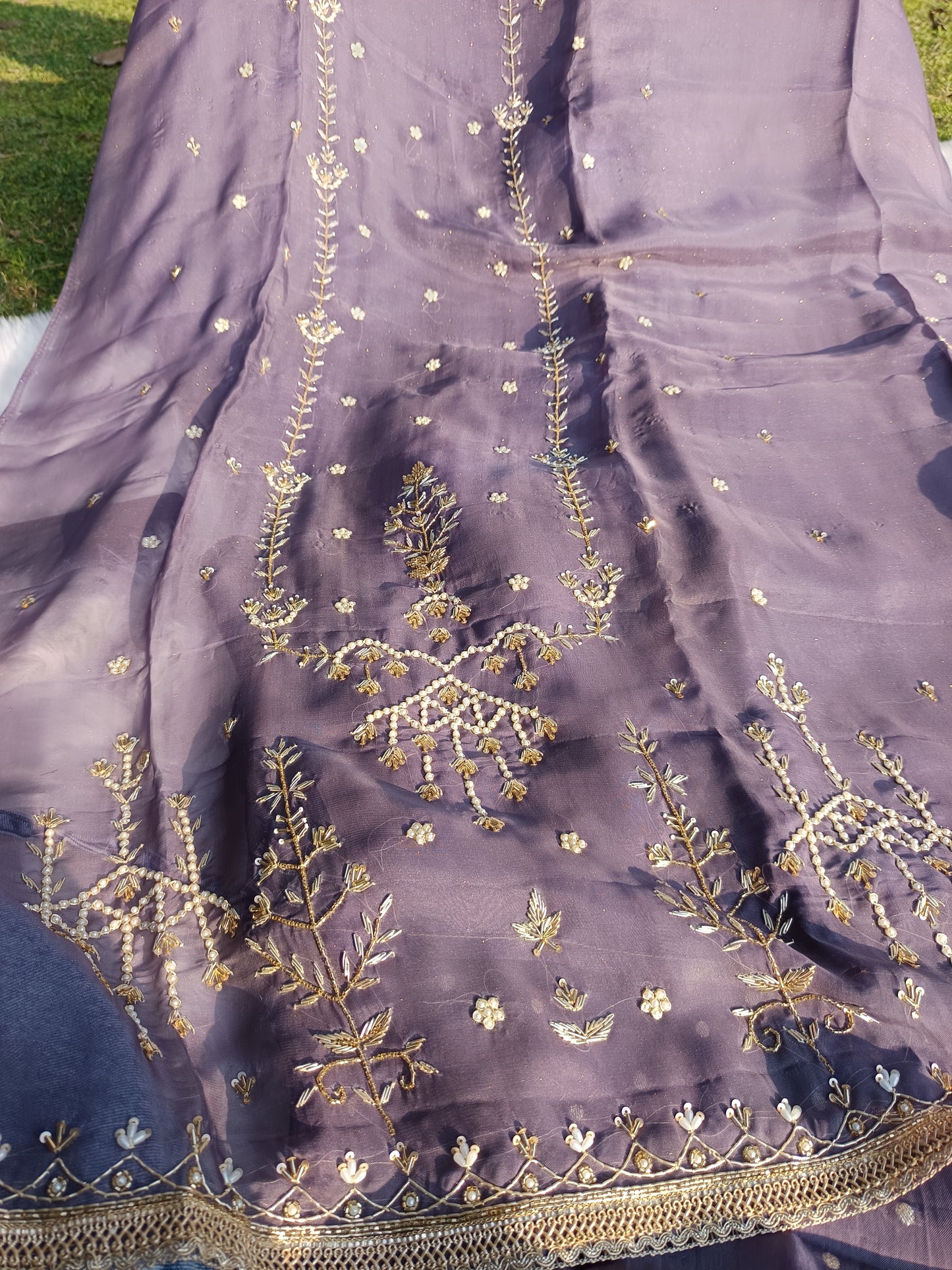 Zoomed-in view of the Shimmer Organza Suit’s hand-embellished sleeve craftsmanship.