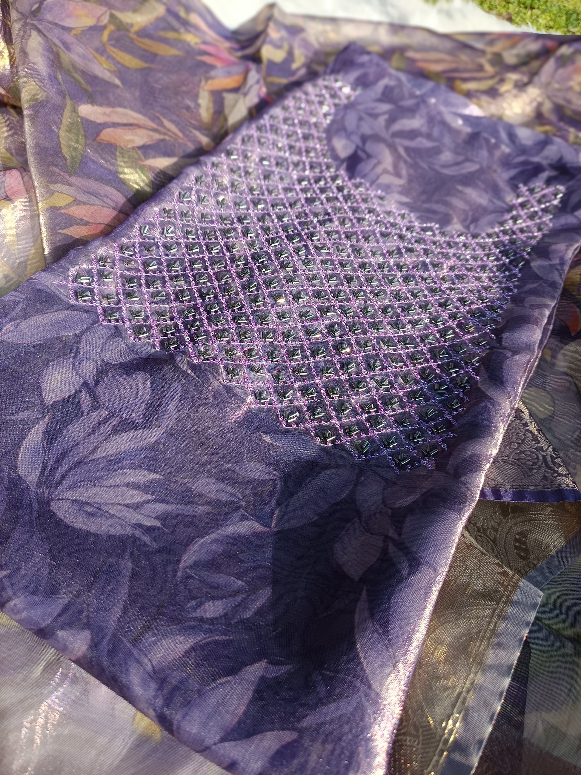 Close-up of subtle thread and handwork embroidery on tissue silk fabric