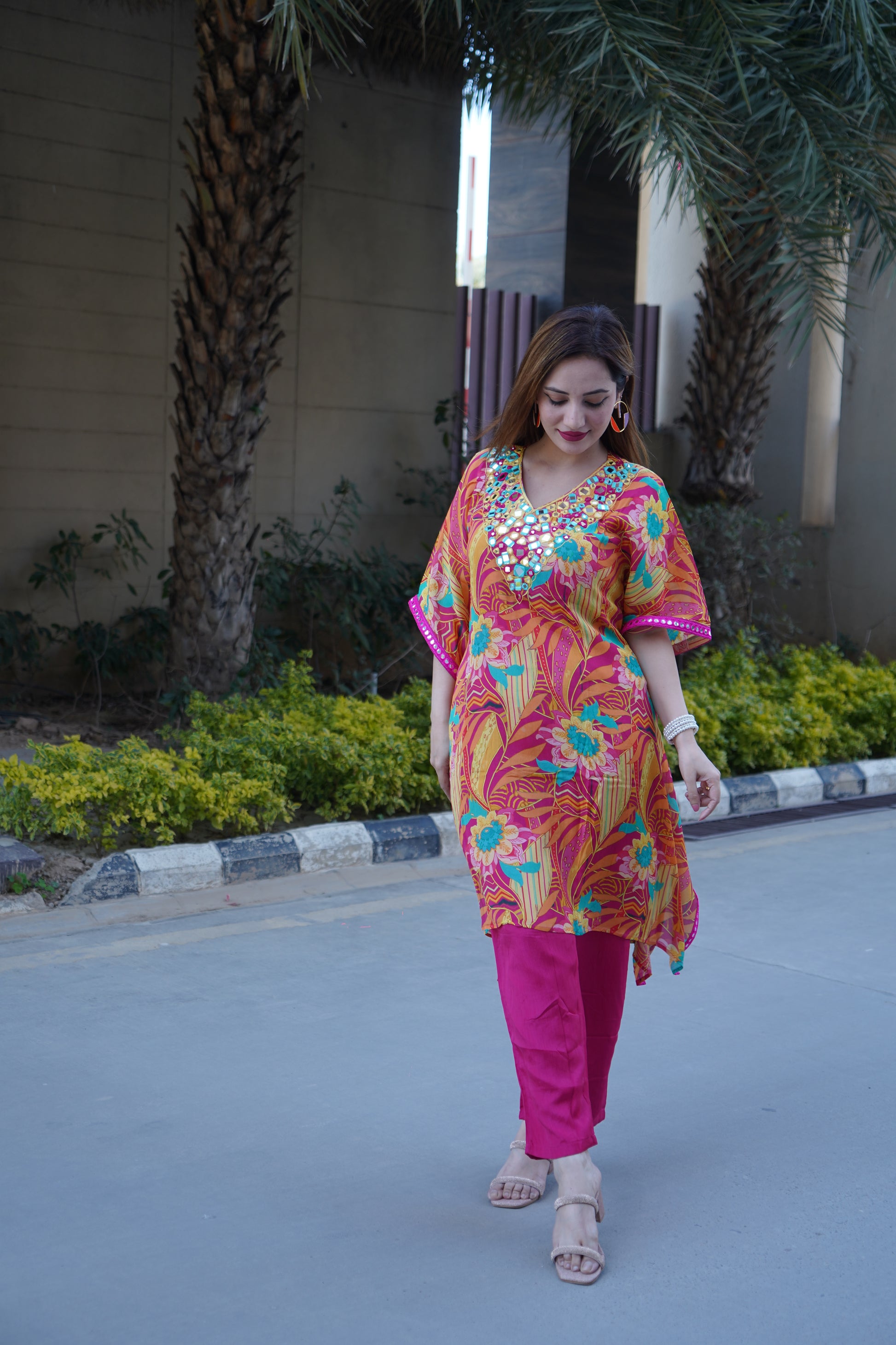 Trendy kaftan style adorned with mirror work details