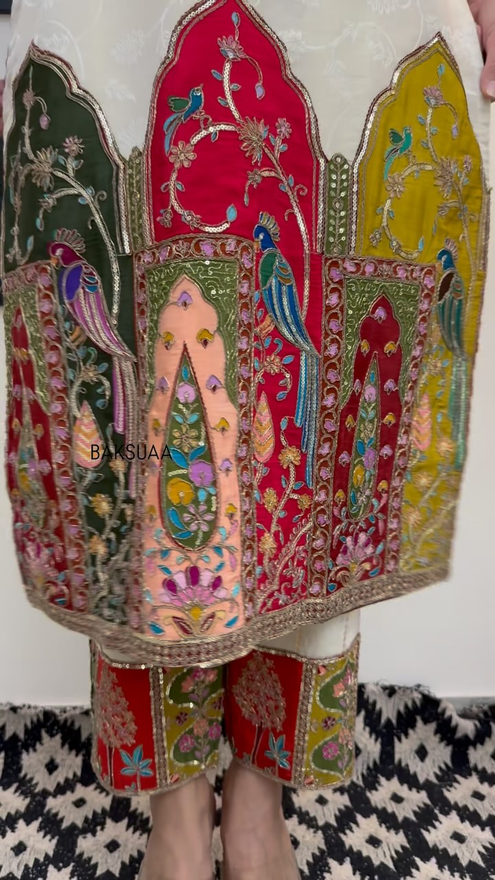 Traditional embroidered kurta set paired with a vibrant Bandhani silk dupatta